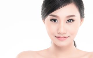 Beautiful Young Asian Woman with Clean Fresh Skin look away, Girl beauty face care. Facial treatment, Cosmetology, beauty and spa.